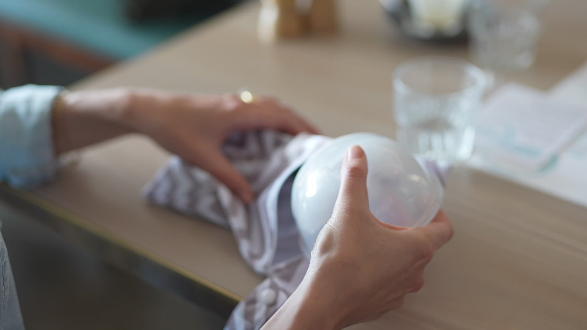 Compact and lightweight breast pump portable option being packed into a bag